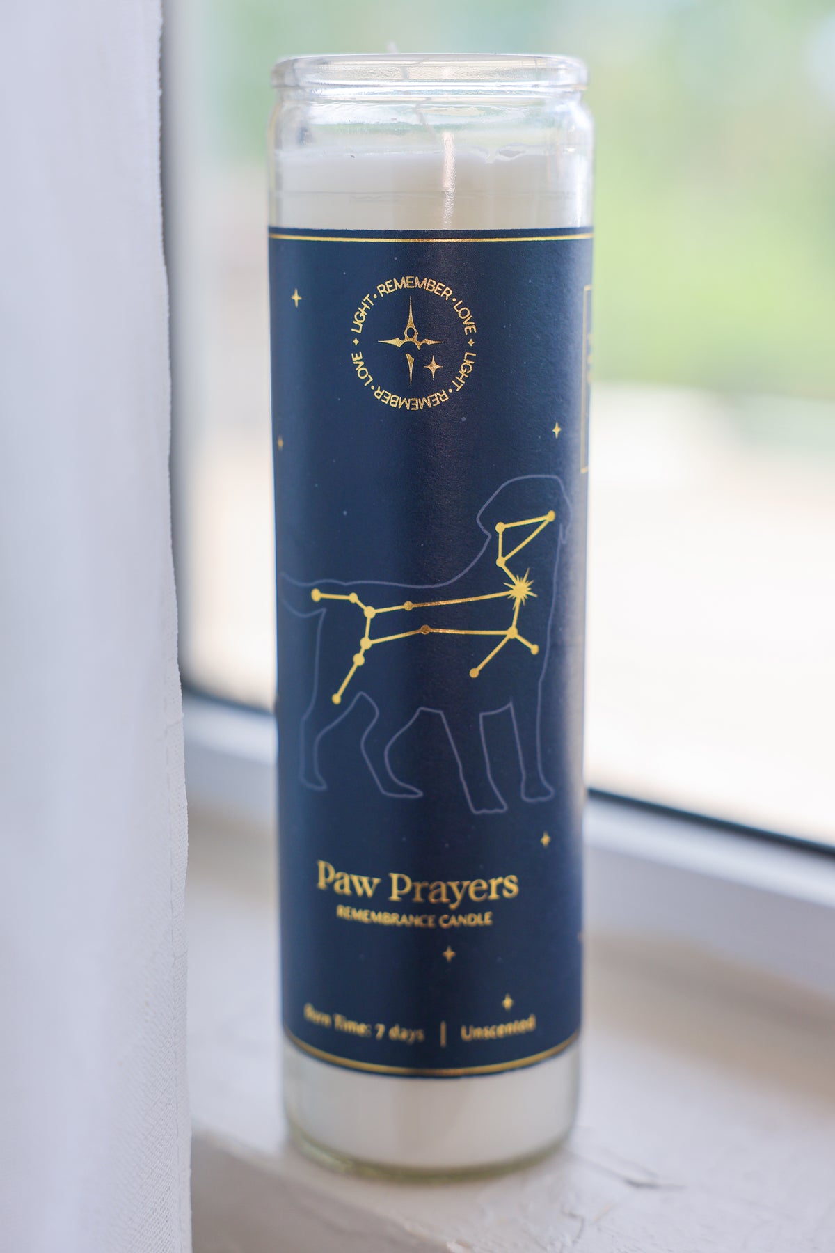 Canis Major constellation pet sympathy gift candle with blue lab el and champagne gold accents.