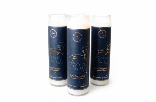 Three tall glass jar candles with navy blue labels featuring a gold constellation design for a bundle set pet memorial gift